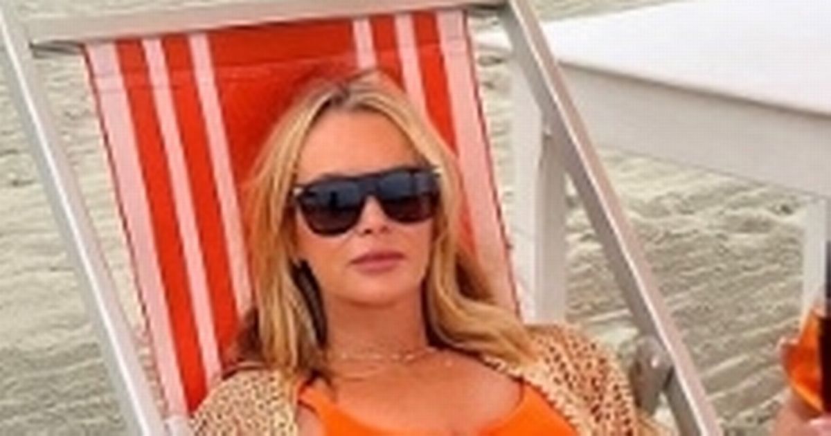 Amanda Holden dazzles in strapless dress as she poses with lookalike daughters
