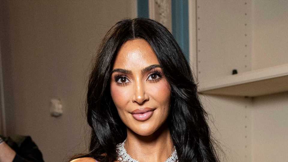 Kim Kardashian suffers NSFW wardrobe malfunction in a silk slip dress at Victoria Beckham's show in Paris | The Sun