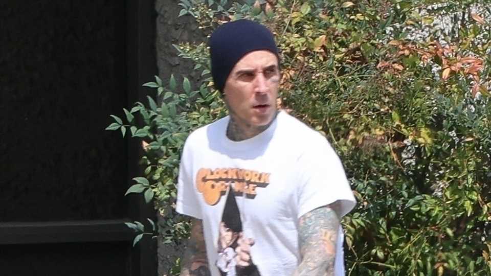 Travis Barker looks somber as he goes solo in LA without pregnant wife Kourtney Kardashian after 'medical emergency' | The Sun