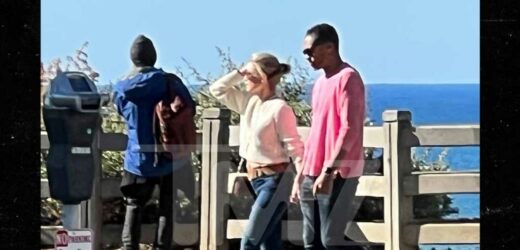 Amy Robach and T.J. Holmes Mark New Chapter with Seaside Stroll and PDA