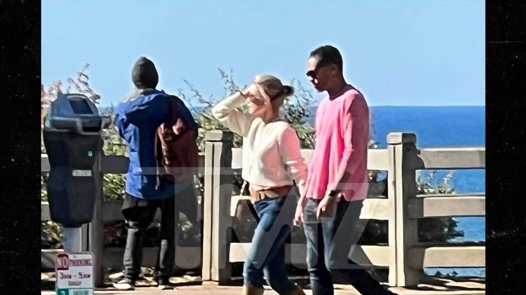 Amy Robach and T.J. Holmes Mark New Chapter with Seaside Stroll and PDA